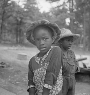 Possibly: Grandchildren of tobacco sharecropper down at barns, Wake County, North Carolina, 1939. Creator: Dorothea Lange.