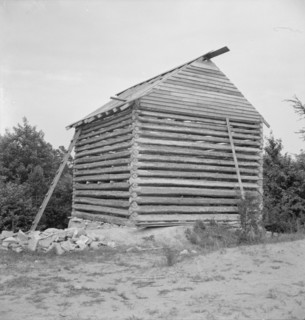 Log cabin barn under construction, near Concord, Person County, North Carolina, 1939. Creator: Dorothea Lange.