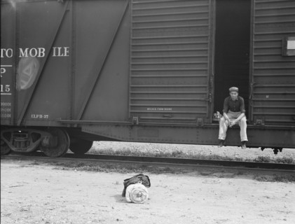 Car on siding across tracks from pea packing plant, Calipatria, Imperial Valley, 1939. Creator: Dorothea Lange.
