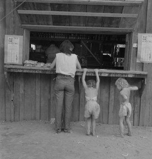Hop picker with her children goes from..., near Grants Pass, Josephine County, Oregon, 1939. Creator: Dorothea Lange.