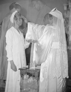 Mrs. Ella Watson, a government charwoman, receiving annointment..., Washington, D.C., 1942. Creator: Gordon Parks.