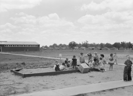 Nursery school children with their teacher, FSA camp, Tulare County, California, 1939. Creator: Dorothea Lange.