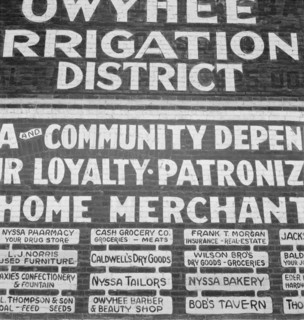 Sign on old bank building now used for office of Bureau..., Nyssa, Malheur County, Oregon, 1939. Creator: Dorothea Lange.