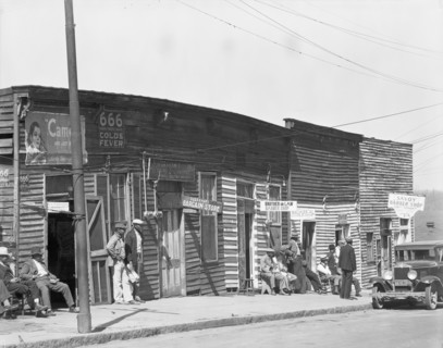 Vicksburg Negroes and shop front, Mississippi, 1936. Creator: Walker Evans.