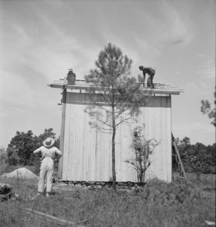 Building plank tobacco barn to replace old log one, near Chapel Hill, North Carolina, 1939 Creator: Dorothea Lange.