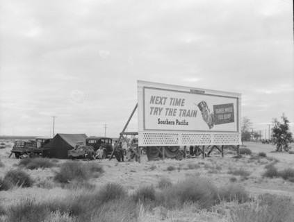 Camped in the rain behind billboard...on U.S. 99, near Famosa, Kern County, California, 1939. Creator: Dorothea Lange.