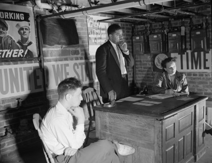 Air raid wardens' meeting in zone nine, Southwest area, Washington, D.C, 1942. Creator: Gordon Parks.