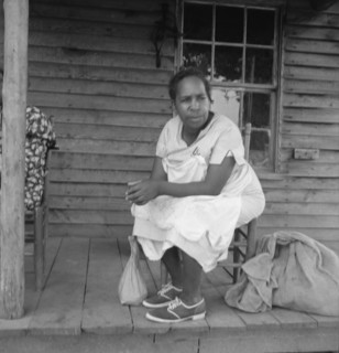 Possibly: Mother of sharecropper family and friend...the rain, Person County, North Carolina, 1939. Creator: Dorothea Lange.