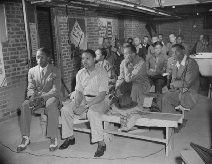 Possibly: Air raid wardens' meeting in zone nine, Southwest area, Washington, D.C., 1942. Creator: Gordon Parks.