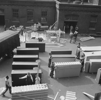 United States government workers and carpenters making crates for steel... Washington, D.C., 1942. Creator: Gordon Parks.