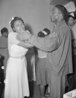 A member of the St. Martin's Spiritual Church, receiving the final..., Washington, D.C., 1942. Creator: Gordon Parks.