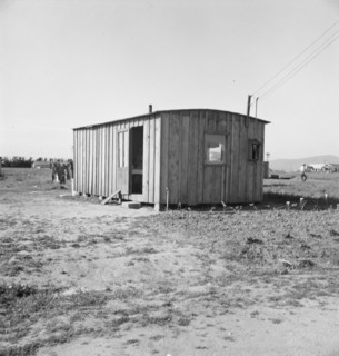 Housing for rapidly growing settlement of lettuce workers on fringe of town, Salinas, CA , 1939. Creator: Dorothea Lange.