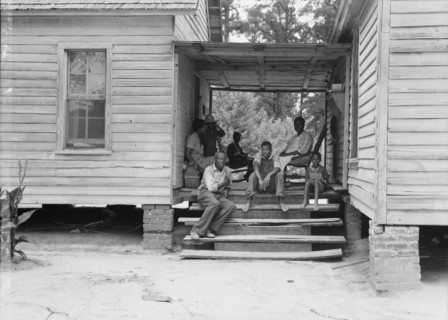Zollie Lyons, Negro sharecropper, home from the field for dinner..., Upchurch, North Carolina, 1939. Creator: Dorothea Lange.