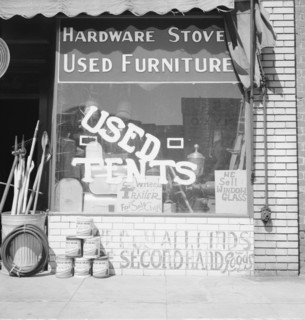 Storefront of San Joaquin Valley town, Fresno, on U.S. 99, California, 1939. Creator: Dorothea Lange.