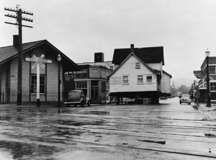 House being moved through the main street of town..., Cottage Grove, Lane County, Oregon, 1939. Creator: Dorothea Lange.