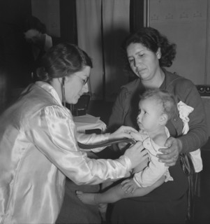 Visiting public health doctor conducts well-baby clinic..., Calipatria, Imperial Valley, 1939. Creator: Dorothea Lange.