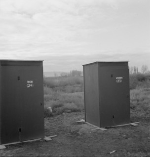 Twenty-four portable toilets, mobile camp (FSA), equipment, Merrill, Klamath County, Oregon, 1939. Creator: Dorothea Lange.