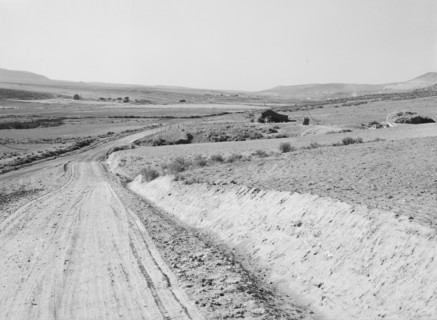 Entering Cow Hollow region in which practically all are FSA borrowers, Malheur County, Oregon, 1939. Creator: Dorothea Lange.