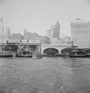 Ferry boats still make train connections which transports passengers in...of New York City, 1939. Creator: Dorothea Lange.