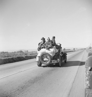 In search of employment as pea pickers, on U.S. 80, Imperial Valley, California, 1939. Creator: Dorothea Lange.
