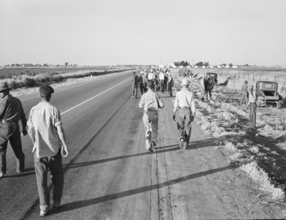 Migratory agricultural workers - cotton hoers, near Los Banos, California, 1939. Creator: Dorothea Lange.