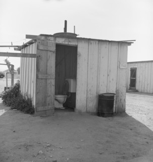 Toilet for ten cabins, men, women, and children, Arkansawyers auto camp, Greenfield, CA, 1939. Creator: Dorothea Lange.