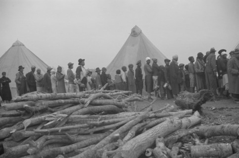 Possibly: Negroes in the lineup for food at meal time in the camp..., Forrest City, Arkansas, 1937. Creator: Walker Evans.