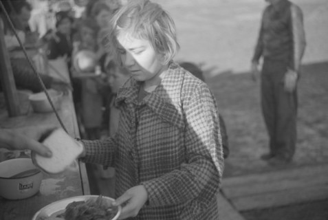 Possibly: Negroes in the lineup for food at mealtime in the camp..., Forrest City, Arkansas, 1937. Creator: Walker Evans.