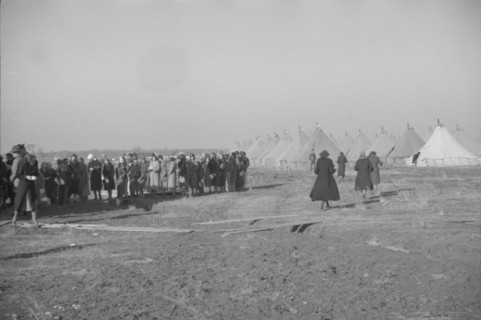 Possibly: Negroes in the lineup for food at mealtime in the camp..., Forrest City, Arkansas, 1937. Creator: Walker Evans.