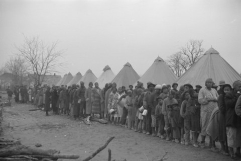 Possibly: Negroes in the lineup for food at mealtime in the camp..., Forrest City, Arkansas, 1937. Creator: Walker Evans.