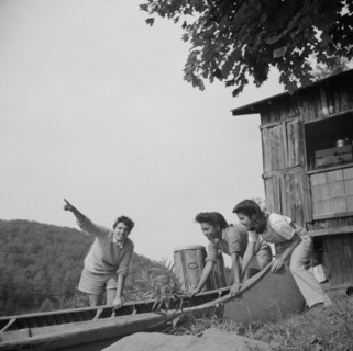 Launching a canoe at Camp Gaylord White, Arden, New York, 1943. Creator: Gordon Parks.
