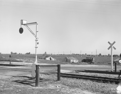 Migrants' tents..., along the right of way of the Southern Pacific, Near Fresno, California, 1939. Creator: Dorothea Lange.