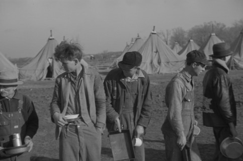 Possibly: Refugees lined up at meal time in the camp for white flood...Forest City, Arkansas, 1937. Creator: Walker Evans.