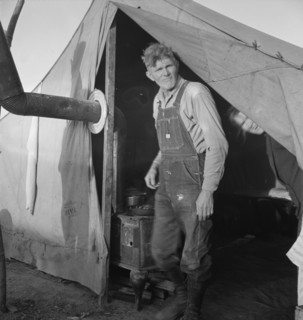 Supper time in FSA migratory emergency camp...the pea fields, Calipatria, CA, 1939. Creator: Dorothea Lange.