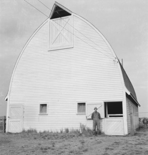 Farmer from Nebraska and his new barn on the Yamhill farms..., Yamhill County, Oregon, 1939. Creator: Dorothea Lange.