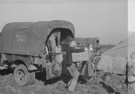 Unloading the household goods of a family who is being moved into..., Forrest City, Arkansas, 1937. Creator: Walker Evans.