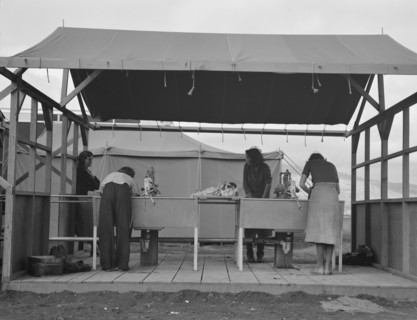 Portable laundry unit, shower unit beyond, FSA camp, Merrill, Oregon, 1939. Creator: Dorothea Lange.