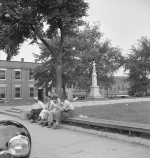 Men idling around the courthouse square, Roxboro, North Carolina, 1939. Creator: Dorothea Lange.