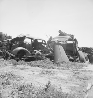 Used car lots and auto wrecking establishments, U.S. 99,  Near Tulare, California, 1939. Creator: Dorothea Lange.