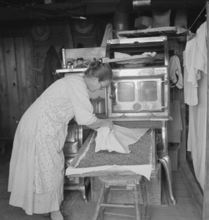 Mrs. Hull drying corn, Dead Ox Flat, Malheur County, Oregon, 1939. Creator: Dorothea Lange.