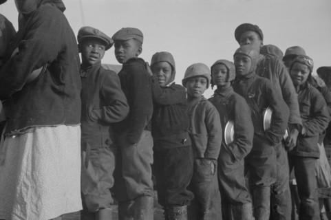Possibly: Negroes in the lineup for food at the flood refugee camp, Forrest City, Arkansas, 1937. Creator: Walker Evans.
