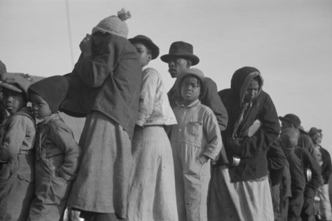 Possibly: Negroes in the lineup for food at the flood refugee camp, Forrest City, Arkansas, 1937. Creator: Walker Evans.