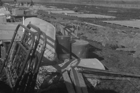 Possibly: Setting up a tent in the camp for white flood refugees, Forrest City, Arkansas, 1937. Creator: Walker Evans.