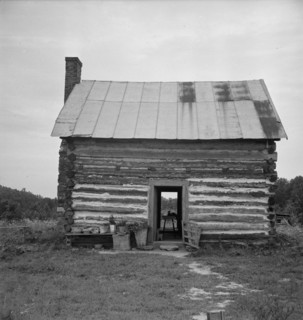 Possibly: Young sharecropper and his first child, Hillside Farm, Person County, North Carolina, 1939 Creator: Dorothea Lange.