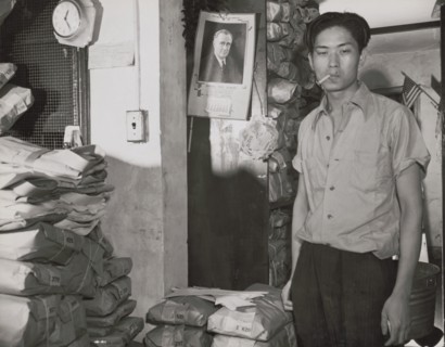 Johnnie Lew, owner of the laundry under the apartment of Mrs. Ella..., Washington, D.C., 1942. Creator: Gordon Parks.