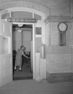 Charwoman cleaning after regular working hours at the Office...Treasury, Washington, D.C., 1942. Creator: Gordon Parks.