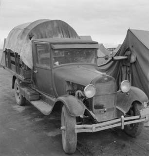 Truck, baby parked on front seat, Merrill, Klamath County, Oregon, 1939. Creator: Dorothea Lange.