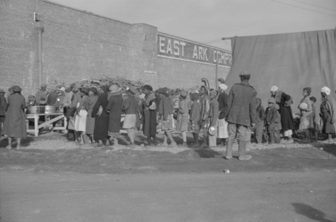 Possibly: Negroes at mealtime in the flood refugee camp, Forrest City, Arkansas, 1937. Creator: Walker Evans.