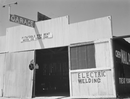 Pit and tools for rent--work on your own, U.S. 99, Fresno County, California, 1939. Creator: Dorothea Lange.