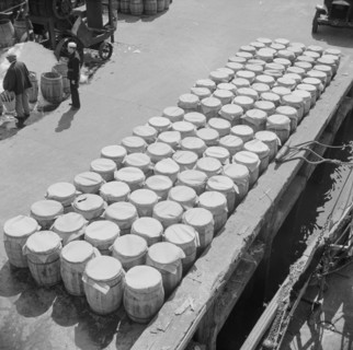 Barrels of fish on the docks at Fulton fish market ready to be shipped to retailers, New York, 1943. Creator: Gordon Parks.